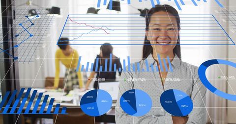 Smiling Woman with Data Visualization Overlay in Office Environment - Download Free Stock Images Pikwizard.com
