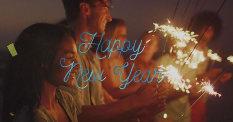 Diverse Friends Celebrating New Year with Sparklers at Night