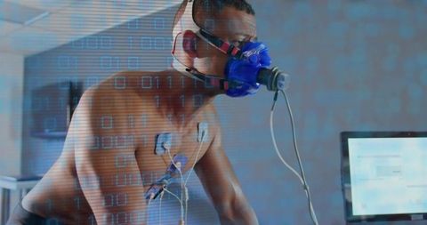 Athlete undergoing cardiopulmonary exercise test wearing metabolic mask and ecg leads