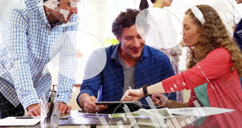 Colleagues Collaborating with Digital Data Overlays in Modern Office