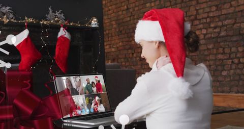 Woman celebrating christmas through virtual family call