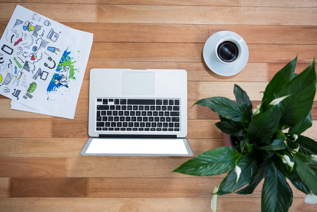 Creative Workspace with Laptop, Coffee, Plant on Transparent Wooden Table - Download Free Stock Videos Pikwizard.com