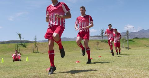 Young Football Team Training on Sunny Field with Athletic Drills - Download Free Stock Images Pikwizard.com