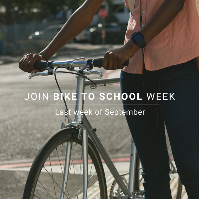 Midsection of african american male with bike and join bike to school week, last week of september. Text, commuter, digital composite, transportation, education, fitness and active lifestyle concept.