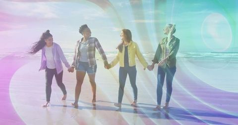 Diverse Friendship Group Holding Hands on Sunny Beach