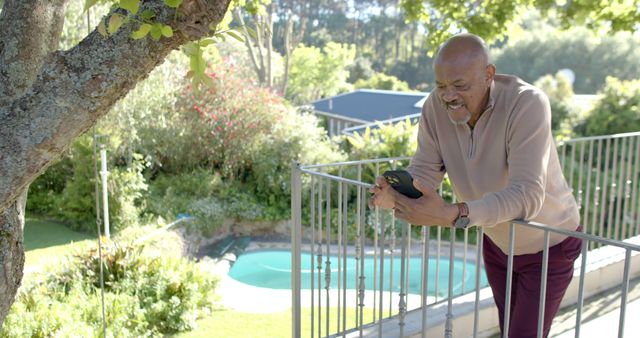 Senior Man Smiling While Looking at Smartphone Outdoors - Download Free Stock Images Pikwizard.com