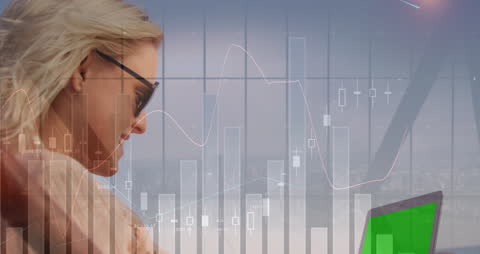 Businesswoman Analyzing Data on Laptop Overlaid with Financial Charts