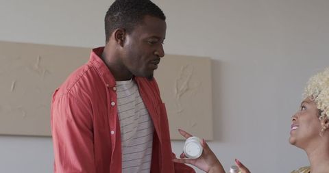 Friends Enjoying Cozy Home Gathering, Chatting and Smiling