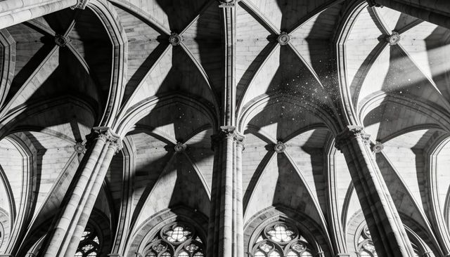 Gothic cathedral ribbed vaults and clustered columns with sunbeams and dust motes