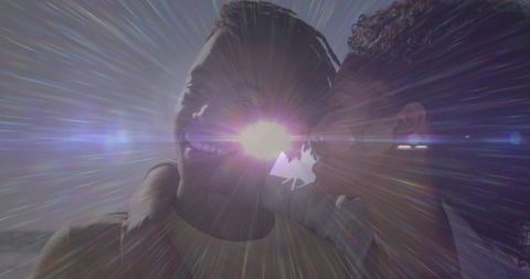 Romantic Sunset Embrace with Sun Flare on Coastal Overlook