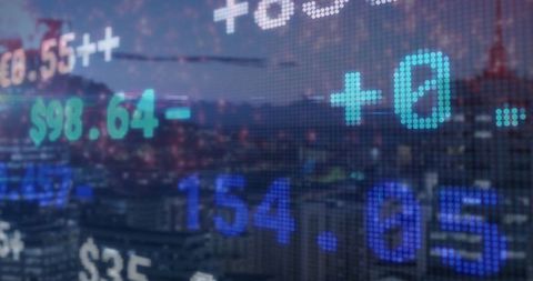 Digital Financial Ticker Overlay on Cityscape at Dusk