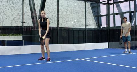 Friends Ready for Padel Game on Modern Court
