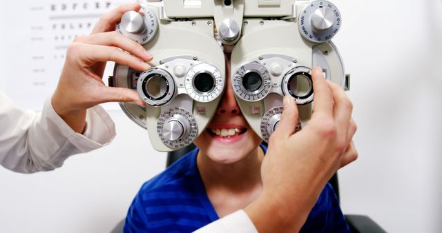 Child Undergoing Eye Examination with Phoropter - Download Free Stock Images Pikwizard.com