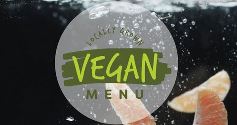 Vegan menu text encased over fresh fruit with water splash aesthetic