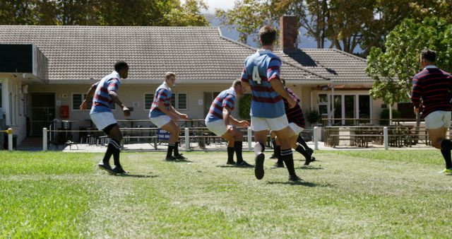 Rugby Players Strategizing on Field During Practice - Download Free Stock Images Pikwizard.com