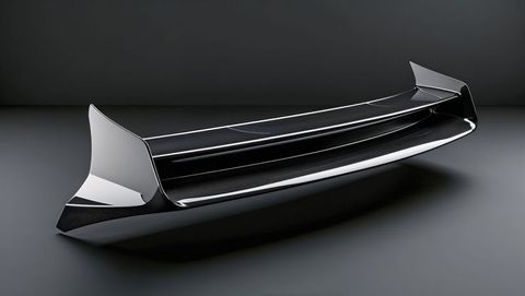 Sleek high-gloss rear spoiler design on reflective surface, streamline form
