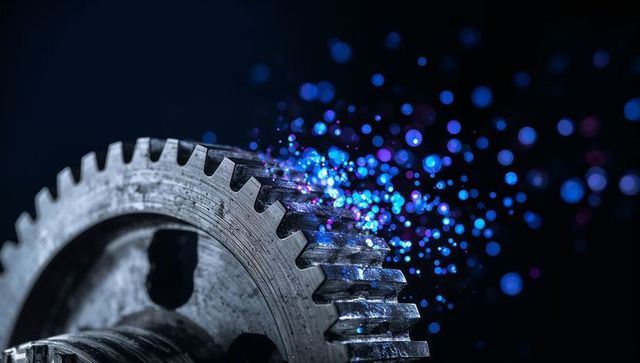 Glowing worn steel spur gear emitting blue purple sparks macro industrial wear concept