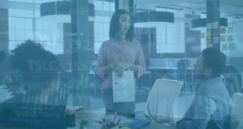 Business Team Analyzing Data in Modern Office Environment