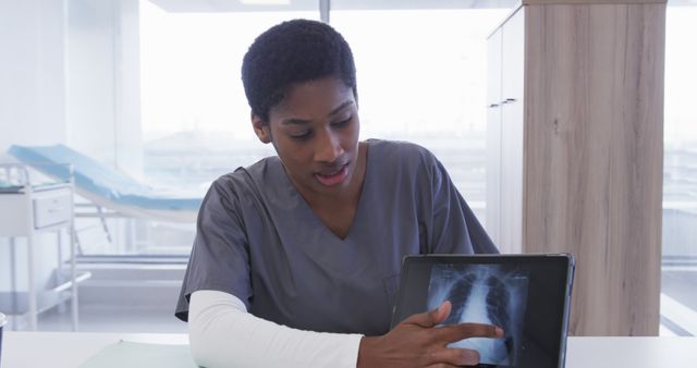 Healthcare Professional Reviewing X-ray Results on Digital Tablet - Download Free Stock Images Pikwizard.com