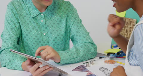 Creative Business Team Collaborating with Tablet