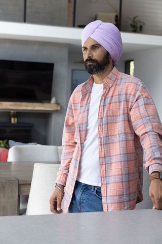 Confident Man in Modern Living Room with Minimalist Decor
