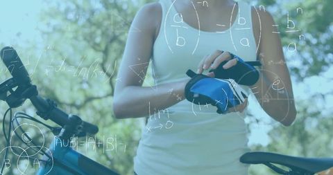 Cyclist Fastening Gloves Beside Blue Bike on Sunlit Park Trail with Math Graphics