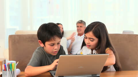 Children Engaged in Technology on Laptop