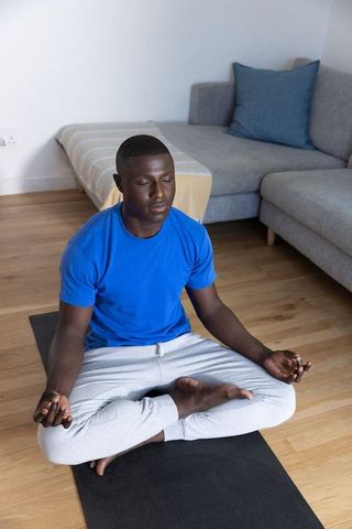 Man Meditating at Home for Mindfulness and Relaxation
