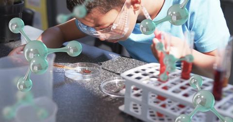 Curious child conducting science experiment with molecular structure
