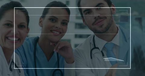 Medical Team Analyzing X-Ray on Screen with Overlay