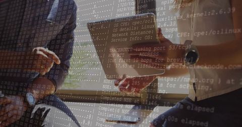 IT Professionals Collaborating with Network Data on Tablet