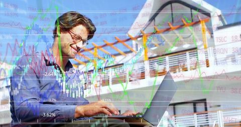 Smiling businessman analyzing stock market data outdoors