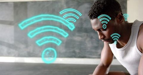 Leaning Man Pausing After Workout in Minimal Studio with Floating Wi-Fi Signals and Focused Gaze