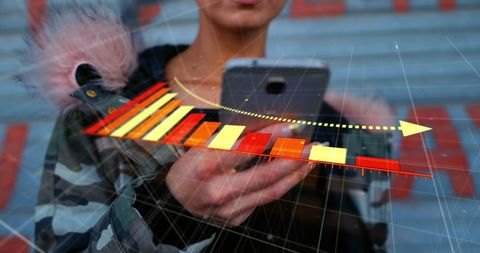 Declining Arrow and Graph Over Woman Using Smartphone