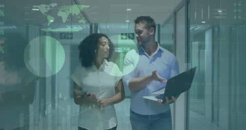 Colleagues Analyzing Digital Data on Laptop at Office