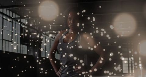 Confident African American Woman Amidst Illuminating Particles