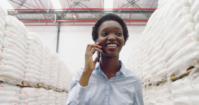 Businesswoman on Phone in Warehouse with Stock - Download Free Stock Images Pikwizard.com