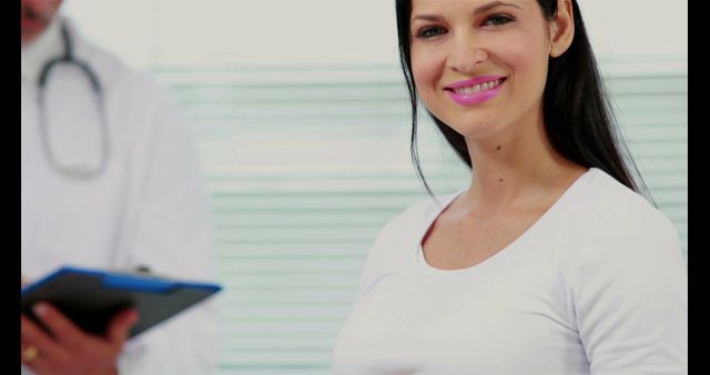 Smiling Pregnant Woman with Doctor During Checkup - Download Free Stock Images Pikwizard.com