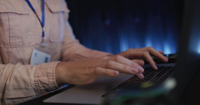 Close-up view of person typing on laptop in professional workspace. Ideal for use in articles, blogs, and marketing materials about office work, technology, remote work, or internet security.