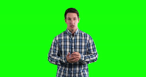 Man in Checked Shirt Presenting on Green Screen