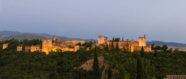 Evening View of Alhambra Palace Illuminated at Dusk - Download Free Stock Photos Pikwizard.com