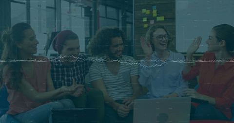 Young Professionals with Financial Data Overlay in Office