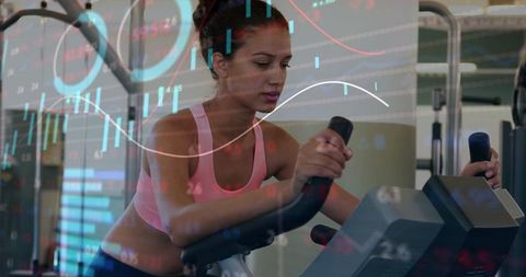Pedaling woman tracking fitness analytics on stationary bike with dynamic data overlay