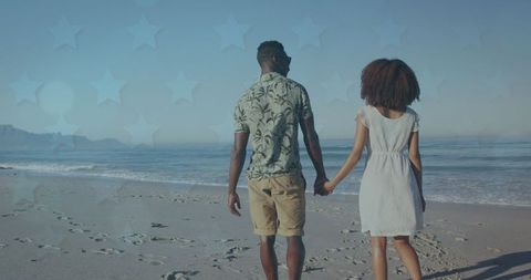 Romantic Couple Holding Hands on Beach with Star Overlay