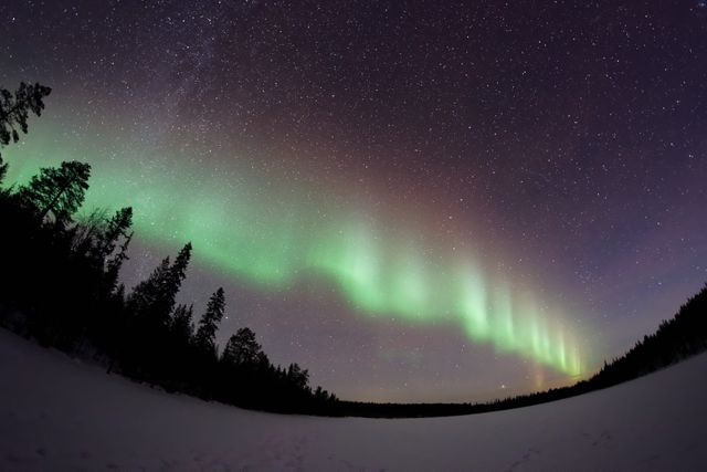 Majestic Northern Lights in Starry Sky Over Snowy Landscape - Download Free Stock Photos Pikwizard.com