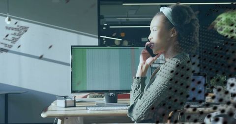 Modern Professional Woman Making Phone Call in Office Setting