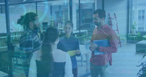 Diverse Team Collaborating in Modern Office with Financial Analytics