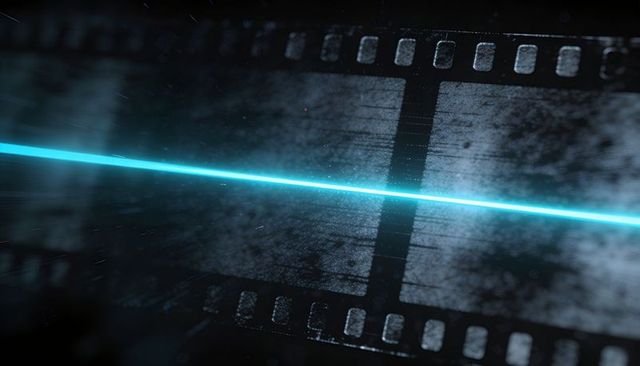 Cyan laser scanning vintage filmstrip with grainy dust and sprocket holes
