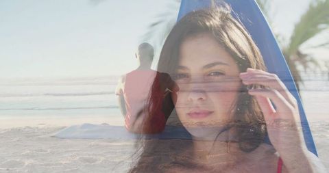 Relaxed beach morning: woman with surfboard and yoga mat