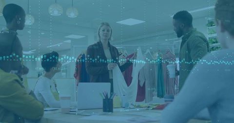 Creative design team in modern studio collaborates on fashion project